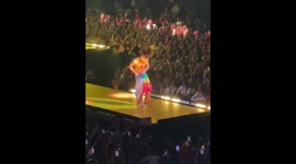 Harry Styles used the pride flag as a skirt to hide his ripped pants