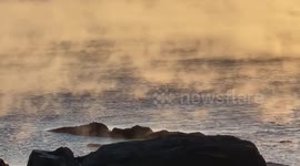 Stunning footage of sea smoke in New Hampshire as record-breaking cold weather hits the northeastern US