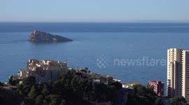 4k aerial footage of Peacock Island off the coast near Benidorm, Spain