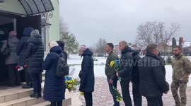 During the funeral of a Ukrainian soldier killed in Donbas, near Soledar, an air raid siren starts in Slavutych, Ukraine