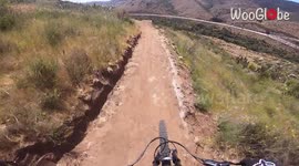 Squad Goals ! MTB rider tries to avoid collision with fellow riders; trips over a rock instead
