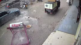 Chinese delivery man narrowly avoids being crushed by water heater