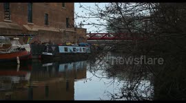 A view of the Ukrainian Flag above a Canal boat near to Kings Cross and St Pancras, London, United Kingdom