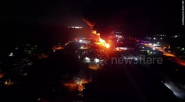 Drone footage captures scale of Ohio train derailment as fears of explosion grow