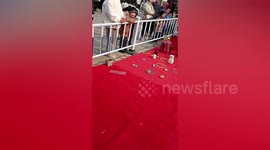 Onlookers amused by boy who threw hoop on girl during ringtoss game