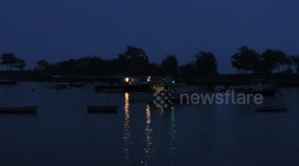 Lobster Boats In The Early Morning Near Boston With Light From Boats Reflecting On Water