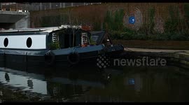 Canal Boats under the Granary Square Footbridge, Kings Cross, London, United Kingdom