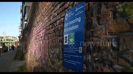 Running past the Camden, Canal & River Trust Sign that gives Eco-mooring Information