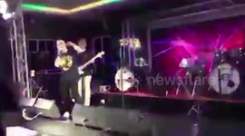 Drunk reveller punches singer on stage at pub in Bangkok