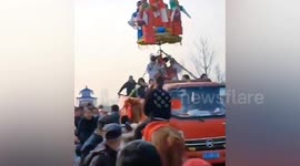 Children on platform fall after support rod holding them up collapses during Lantern Festival activity in China