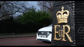 Driving past one of the E II R posts which make Regents Park famous, London, United Kingdom