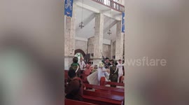 Happy groom and bride pass under sword arch military tradition