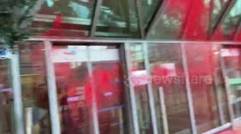 Climate activists spray red paint at energy company after announcement of record profits in France