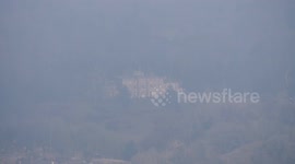 Intense fog blankets Willersley Castle at Cromford, England