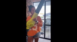 Wife pranks husband by using leaf blower on him as he brushes his teeth