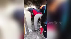 Rescuers Risk Crush To Free Woman Trapped Under Building In Adiyaman, Turkey