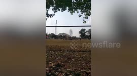 Terrified footballers run when dust devil tornado sucks up team tent