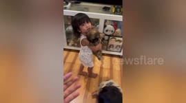 Sad toddler refuses to return puppy friend recently sold at mum's pet shop