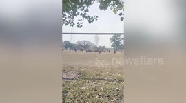 Tornado hits football match picking up team tent and dumping it on pitch