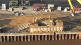 No-fly zone in place and sand wall built around unexploded bomb found in river