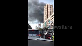Massive fire erupts at bus terminal in Quezon City, Philippines, several commercial establishments burned