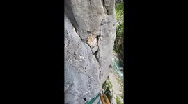 Climber narrowly avoids falling boulder while 100metres off ground