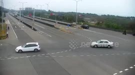 Truck smashes into tanker and topples it over at intersection in Taiwan