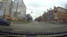 Close Call: Car Speeds Through Red Signal Nearly Causing an Accident
