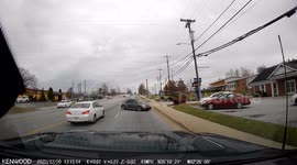 Reckless Driving: Volkswagen Crosses Lanes of Traffic and Collides With Parked Vehicle
