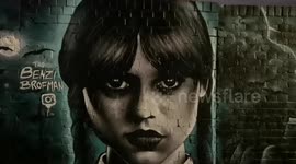 Amazing Wednesday Adams graffiti art in Brick Lane East London