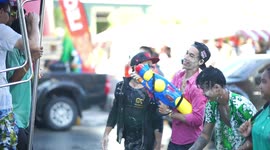 Thai people celebrating Songkran festival, which is New Year in Thai calendar, also called water splashing festival.