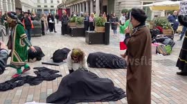 Women 'liberated' from black drapes during protest against Iranian regime in London