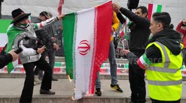 Iranian diaspora burns flags during a protest in London