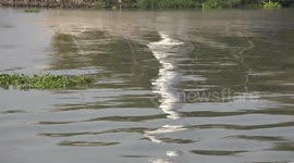 Ghostly reflections of a lighthouse on a river taken at Ayutthaya Thailand.