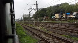 Trains Crossing in Odisha High speed train crossing countryside station in Orissa India