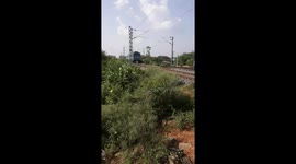 Train passing Bolangir railway gate in Odisha . Railway Level Crossing In India - Indian Railways.