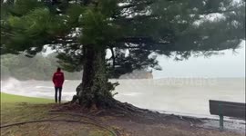 Waves crash against New Zealand coast as Cyclone Gabrielle strikes