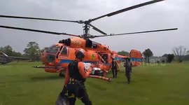 Firefighting helicopters dump water on forest fires in northern Thailand
