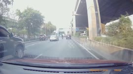 Driver shocked when huge rock thrown from bridge smashes his car windscreen