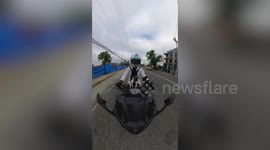 Awesome 360 view of Pug puppy sitting on front of motorcycle with owner