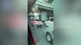 Porsche with K-Pop group BlackPink's signatures drives along road in Thailand