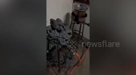 Stove melts into charred mess after dozey shop owners leave fire on to take a shower