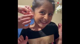 Five-year-old girl goes through rollercoaster of emotions during ear piercing