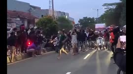 A racing event in Indonesia takes an unexpected turn as a man is struck by a motorcycle