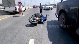 German biker stuck under car after motorcycle crash with pick-up truck