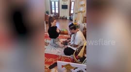 Black magic doctor rubs 'magic wooden dildos' on devotees for good luck