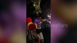 Tourist makes 25ft-high jet spray out of voice-controlled shout fountain in Malaysia