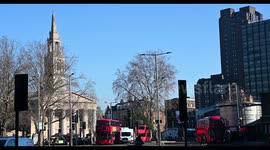 Buses Driving past St John's Church, Waterloo, London, United Kingdom