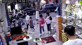 Large cleaver narrowly misses pedestrians after falling from building in China