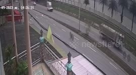 Keep rolling! Two loose wheels from lorry travel along road before hitting shop and ATM machine